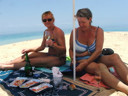 Ladies enjoying the beach in the lagoon with Bomani Beach Bungalows.
