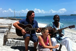 The BFFamily and Salavdor enjoys music together on the beach at Bomani. 